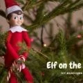 piros ruhás játék karácsonyi manó cukorpálcával a kezében ül a karácsonyfa ágai közt